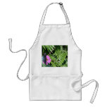 Blue black butterfly on purple flower, green leaf apron