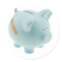 Blue china piggy bank with fabric bandage stickers