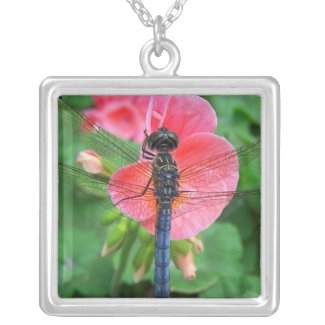 Blue dragonfly on pink flower green background necklace