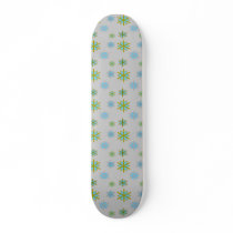 Blue green snowflakes on silver custom skateboard