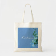blue hydrangea flowers in blue background tote bags