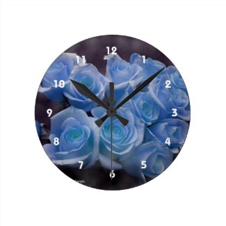 Blue Rose colorized bouquet spotted background Round Clocks