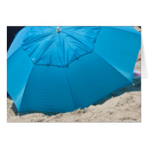 blue umbrella in the sand card