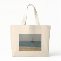 Boat off Bournemouh beach Tote Bags