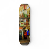 Bottles of Chemicals Green and Brown Skate Board
