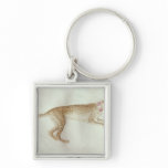 Bounding cheetah with a red collar key chain