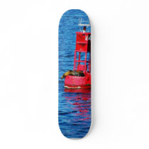 Bouy In San Diego Bay With A Seal On It skateboards by lifesphere Bouy In San Diego Bay With A Seal On It skateboards