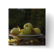 Bowl of apples and leaves buttons