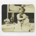 Boy holding teddy bear mousepads