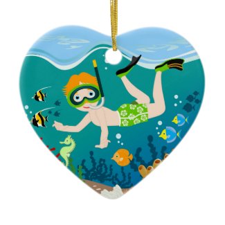 Boy swimming and diving with tropical fish christmas tree ornaments