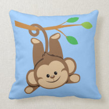 Boy Swinging Monkey Pillows