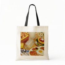 Breakfast of bacon, eggs and pitcher of milk  flow tote bag