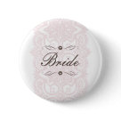 round_button - This beautiful Bride button design features an ornate patterned background in pink with chocolate brown text. It's simply elegant. Customize with your personal information. Ready to dress up your save the date mailings! Additional colors and other coordinating items available in the design. Please visit Two Hearts Wedding Shoppe for a lovely selection of Wedding Postage, Save The Date announcements, Wedding Party Buttons, Bridal Party T-Shirts and other wonderful keepsakes.