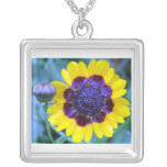 Bright yellow with blue center flower necklace