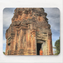 Buddhist monk standing in doorway of temple mouse pads