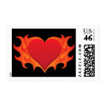 Burning red heart engulfed in flames postage stamp