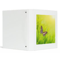 Butterfly sitting on a fresh green grass 3 ring binder