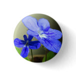 Button with beautiful blue flower