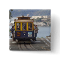 Cable car chugs up Hyde Street in San Button
