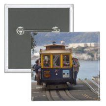 Cable car chugs up Hyde Street in San Button