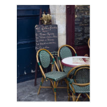 Cafe table with cane chairs in Paris, France Post Cards