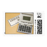 Calculator and Ledger (2) postage