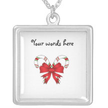 Candy canes with red ribbon pendants