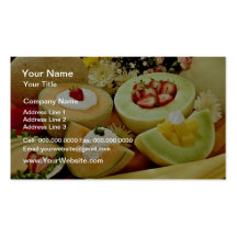 Cantaloupes and melons on cutting board with flowe business card template
