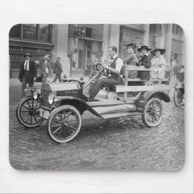 Auto  Domestic Racing on Of A Man Giving Some Women A Ride In A Open Air Auto During A Car