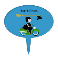 Cartoon Witch Riding A Green Moped Cake Topper