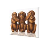 Carving of three wooden monkeys canvas print