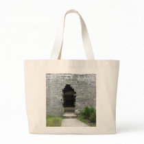 Castle ruins tote bags