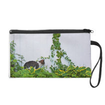 Cat in front of a white fence wristlet