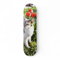 Cat Next To The Red Tulips On The Garden skateboards