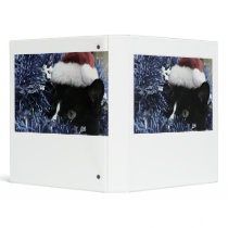 Cat ready to pounce behind blue tinsel, faded tint 3 ring binder