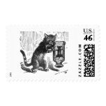 Cat Shakes Bottle Containing Mouse Postage Stamps