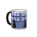 Cat watching bumble bee mugs