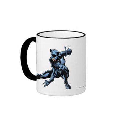 Catwoman crouches mugs