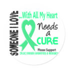 round_sticker - Support the person in your Life battling Celiac Disease by promoting Celiac Disease Awareness and advocating the Cure with SOMEONE I LOVE NEEDS A CURE tshirts and gifts featuring a Light Green Heart Ribbon.  Ideal for Celiac Disease Awareness Month, Celiac Disease Walks, Celiac Disease Support Events, or anytime!  VISIT OUR ZAZZLE STORE  TO SEE MORE EXCLUSIVE CELIAC DISEASE DESIGNS FOUND ONLY AT AWARENESS GIFT BOUTIQUE, A PROUD ZAZZLE PRO-SELLER.