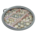 Charentais melons displayed in grocery store oval belt buckles