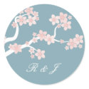 Cherry blossom on blue circle sticker sticker