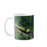 Chicago and Northwestern EMD No. 8028 with ore tra mugs
