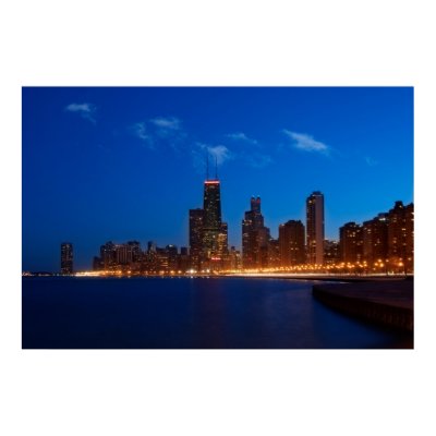 Nighttime view of the Chicago, Illinois skyline along Lake Michigan.