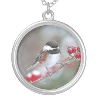 Chickadee in Falling Snow with Red Berries