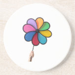 Child hand holding a pinwheel beverage coasters