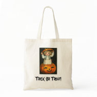 child in jackolantern bag