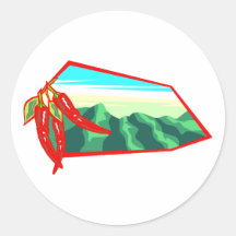 Chilis with moutain range behind round stickers