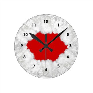 Christmas wallclock with Santa’s beard in white surrounding the red clock face