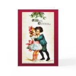 Christmas greeting with a boy hugs a girl