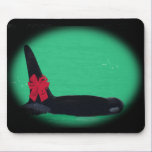 Christmas Orca Whale with Red Bow on Green Backgro mousepads